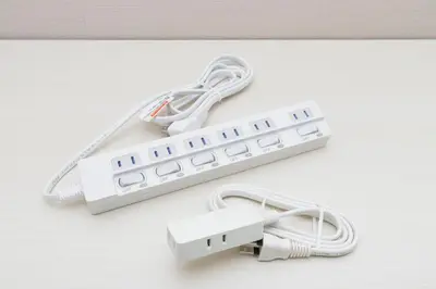 a white remote control sitting on top of a table at Latte Sakura View Oshiage, 10min walk to Tokyo Skytree, walk to Asakusa in Tokyo