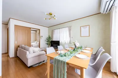 a living room with a table and a couch at Nico Galleria Ōyama in Tokyo