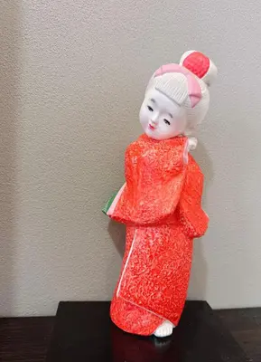 a figurine of a woman in a red dress at Joy \u4e1c\u4eac\u6674\u7a7a\u5854 in Tokyo