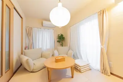 a living room with a chair and a table at Higashi-Ikebukuro-5dk-TS0456 in Tokyo