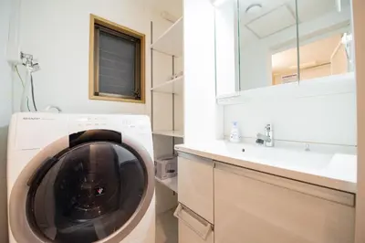 a washing machine in a bathroom with a sink at Higashi-Ikebukuro-5dk-TS0456 in Tokyo