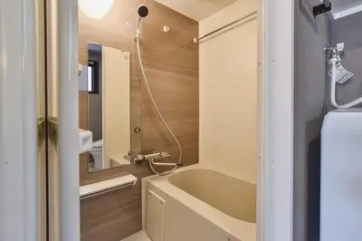 a bathroom with a bath tub and a sink at Bldg E Tokyo in Tokyo