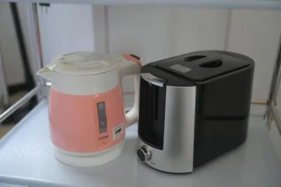 a blender and a toaster sitting on a counter at Wonderful stay TOKYO KURAMAE in Tokyo