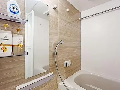 a bathroom with a shower and a tub and a sink at Tokyo Stay GB Sugamo in Tokyo