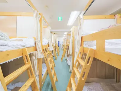 a group of bunk beds in a dorm room at Dormitory \u30b5\u30fc\u30af\u30eb\u30c6\u30f3- Share Room For Male Only \u7537\u6027\u5c02\u7528\u30c9\u30df\u30c8\u30ea\u30fc in Tokyo