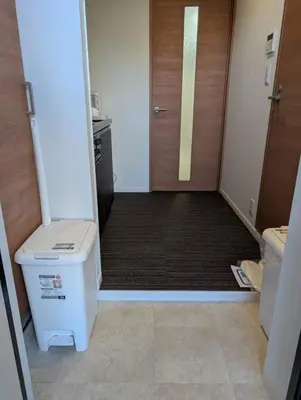 a small bathroom with a toilet and a door at incense\u4e0a\u91ce\u6839\u5cb85\uff26 in Tokyo