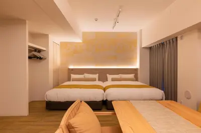 two beds in a hotel room with two beds at Hotel TOKI \u5b63 in Tokyo