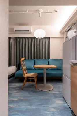 a living room with a couch and a table at Hotel TOKI \u5b63 in Tokyo
