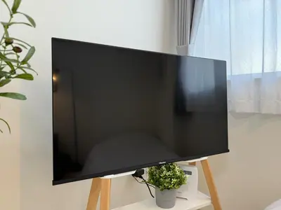 a large flat screen tv sitting on a stand at FINOA Residential Suite Takaido in Tokyo