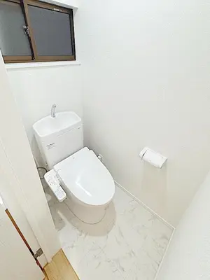 a white bathroom with a toilet and a window at Tokyo Stay Itabashi House in Tokyo
