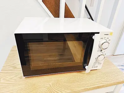 a microwave oven sitting on top of a table at Tokyo Stay Itabashi House in Tokyo