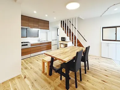 a kitchen and dining room with a wooden table and chairs at Tokyo Stay Itabashi House in Tokyo