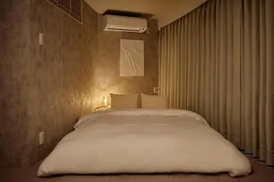a bedroom with a large white bed in it at Noël Shibuya Once -Luxury Residence in Tokyo