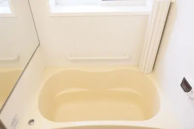 a toilet in a bathroom with a window at Dori Dori House Ebisu in Tokyo
