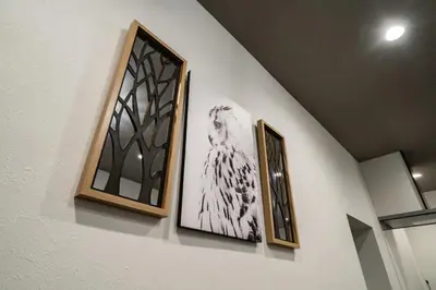 three framed pictures hanging on a wall at \u30a2\u30f3\u30c9\u30b9\u30c6\u30a4\u5800\u52076\u4e01\u76ee in Tokyo
