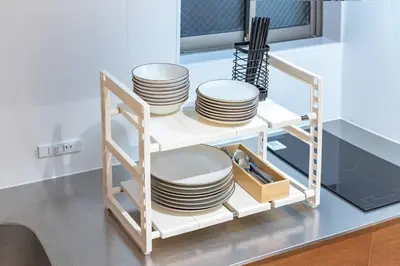 a plate rack with plates on it in a kitchen at 9Stay \u83ca\u5ddd in Tokyo