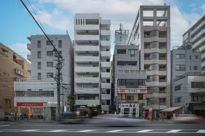a city with tall buildings and a street with cars at 9Stay \u83ca\u5ddd in Tokyo