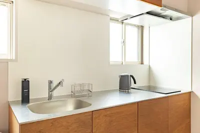 a kitchen with a sink and a counter top at 9Stay \u83ca\u5ddd in Tokyo