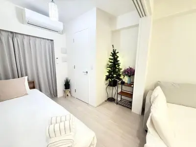 a white bedroom with a christmas tree in it at Ying-Higashi Shinjuku-SJ0061 in Tokyo