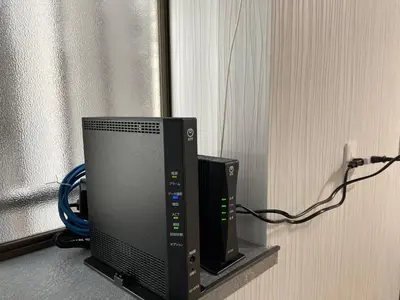 a computer monitor sitting next to a window at Dolce Vita Ebisu in Tokyo