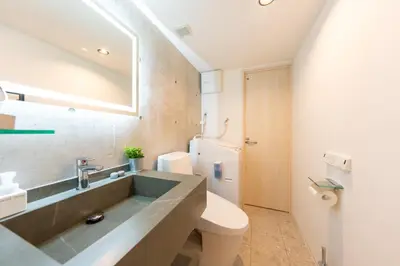 a bathroom with a sink and a toilet at GLANNIR Higashi kitazawa 102 in Tokyo