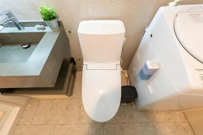 a white toilet in a bathroom next to a sink at GLANNIR Higashi kitazawa 102 in Tokyo