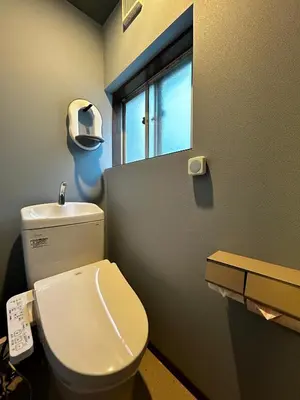 a bathroom with a white toilet and a window at \u4e2d\u91ce\u99c5\u5357inn Nakano Station South Inn in Tokyo