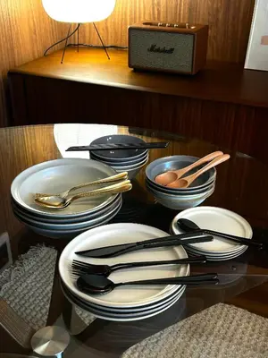 a shelf with plates and utensils in a cabinet at \u4e2d\u91ce\u99c5\u5357inn Nakano Station South Inn in Tokyo