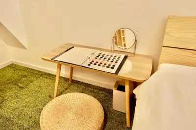 a desk with a mirror next to a bed at SGC\u8535\u524d2\u4e01\u76ee4f in Tokyo