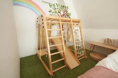 a bunk bed with a ladder and a rainbow at SGC\u8535\u524d2\u4e01\u76ee4f in Tokyo