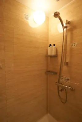 a bathroom with a shower with a shower head at SGC\u8535\u524d2\u4e01\u76ee4f in Tokyo