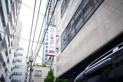 a building with signs on the side of it at SGC\u8535\u524d2\u4e01\u76ee4f in Tokyo
