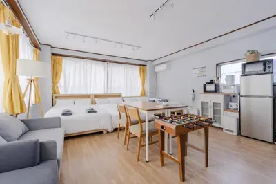 a room with a bed and a table with a chessboard at Private Floors 2F and 3 to 5F for up to 18 Guests 8 min walk from JR Hamamatsucho HOTEL Musashi Tokyo Shiba in Tokyo