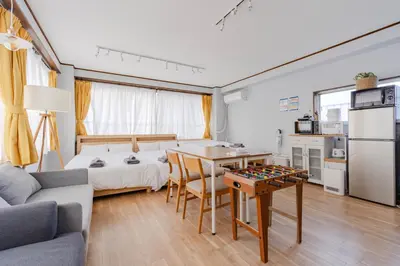 a room with a bed and a table with a chessboard at Private Floors 2F and 3 to 5F for up to 18 Guests 8 min walk from JR Hamamatsucho HOTEL Musashi Tokyo Shiba in Tokyo
