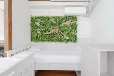 a bedroom with a wall covered in ivy at Private Floors 2F and 3 to 5F for up to 18 Guests 8 min walk from JR Hamamatsucho HOTEL Musashi Tokyo Shiba in Tokyo