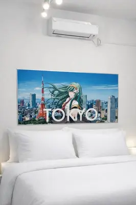 a bedroom with a poster of the tokyo tower at Private Floors 2F and 3 to 5F for up to 18 Guests 8 min walk from JR Hamamatsucho HOTEL Musashi Tokyo Shiba in Tokyo