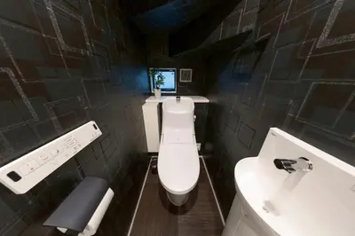 a bathroom with a white toilet and a sink at 3-minute walk from Nishi-Shinjuku Station 100square meters Entire Private House 4LDK in Tokyo