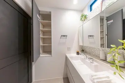 a bathroom with a sink and a mirror at 3-minute walk from Nishi-Shinjuku Station 100square meters Entire Private House 4LDK in Tokyo