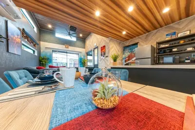 a kitchen and living room with a dining table with a pineapple at 3-minute walk from Nishi-Shinjuku Station 100square meters Entire Private House 4LDK in Tokyo