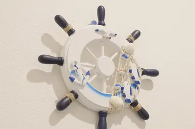 a blue and white clock on a wall at Dori Dori House Sumida in Tokyo