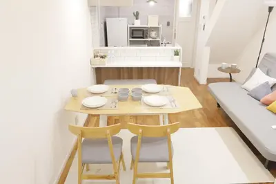 a small table and chairs in a living room at Dori Dori House Sumida in Tokyo