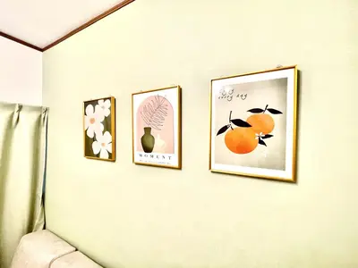 four pictures are hanging on a wall at ntb\u5800\u52072\u4e01\u76eeESTA 2 in Tokyo
