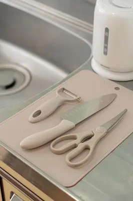 a pair of scissors sitting on top of a counter at B&B 103 under the clear sky Go straight to Narita 8 minutes on foot from Kinshicho Station 1 minute on foot from Asakusa and Skytree 50 minutes from Disneyland 1 minute from Monopolis in Tokyo