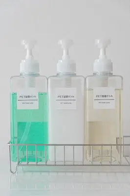 three bottles of soap sitting on a shelf at Minshuku 203 under the clear sky 8-minute walk from Kinshicho Station direct line to Narita Airport 50-minute walk from Disneyland and 1-minute walk from the mall in Tokyo