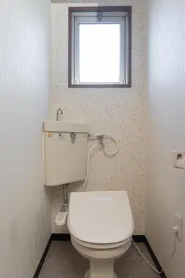 a bathroom with a white toilet and a window at Clear Sky Guesthouse 305 Direct to Narita Airport, 8-minute walk from Kinshicho Station, within walking distance of Asakusa and Clear Sky Tower, 50 minutes to Disneyland, 1 minute to the mall in Tokyo