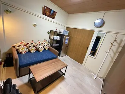 a small living room with a couch and a table at NEW OPEN Available for 10 people 1 line to airport in Tokyo