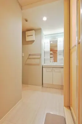 a small kitchen with white cabinets and a sink at v close to Noagata 15 min to Shinjuku station in Tokyo