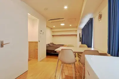 a dining room and living room with a table and chairs at v close to Noagata 15 min to Shinjuku station in Tokyo