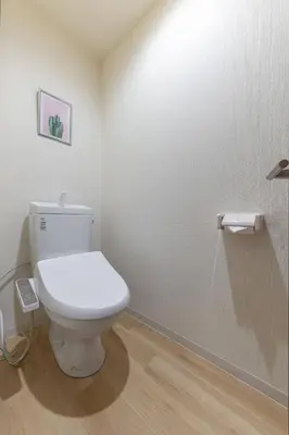 a bathroom with a white toilet in a room at \u65e5\u66ae\u91ccMori House A in Tokyo