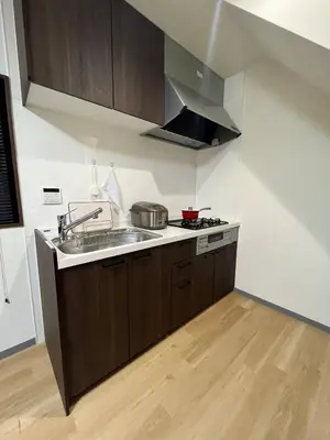 a kitchen with a sink and a stove at \u65e5\u66ae\u91ccMori House A in Tokyo